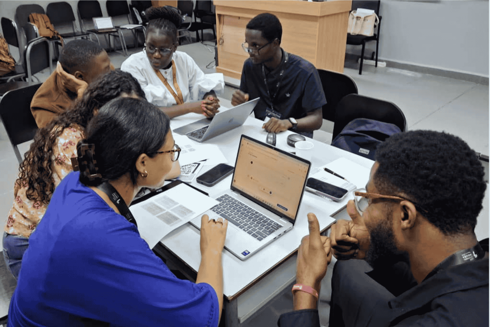 Participants working in groups to explore multi turn scenarios and human centred approaches to AI evaluation.